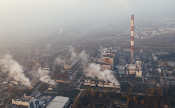 Smoke comes out of a large factory